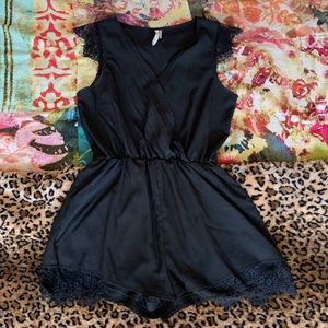 Unique black romper with lace detail